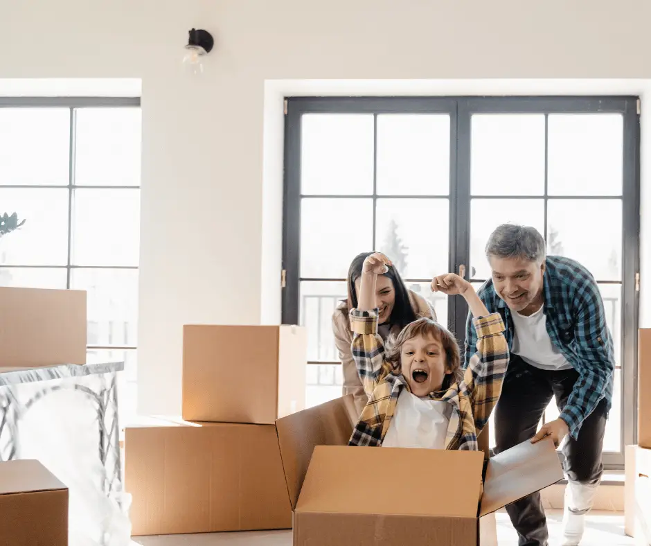 A family unpacking boxes in their new home